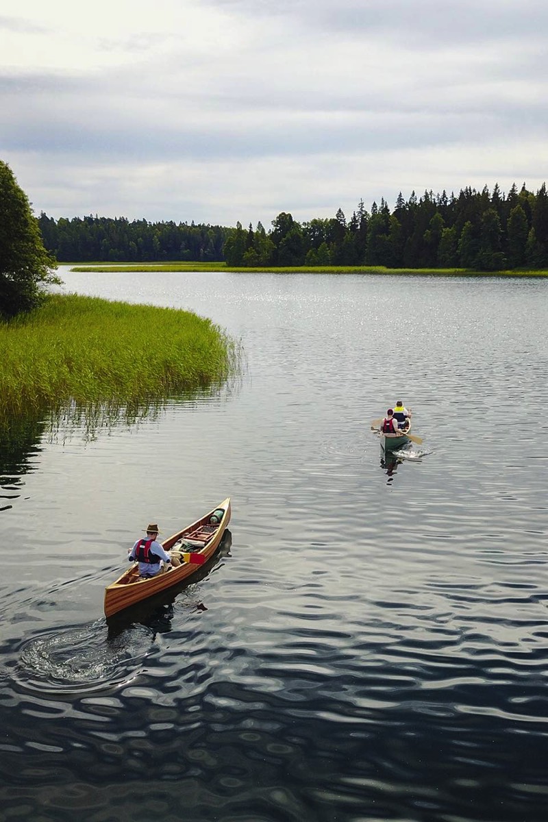 One canoe following another during a canoe tour in Plateliai lake, Lithuania