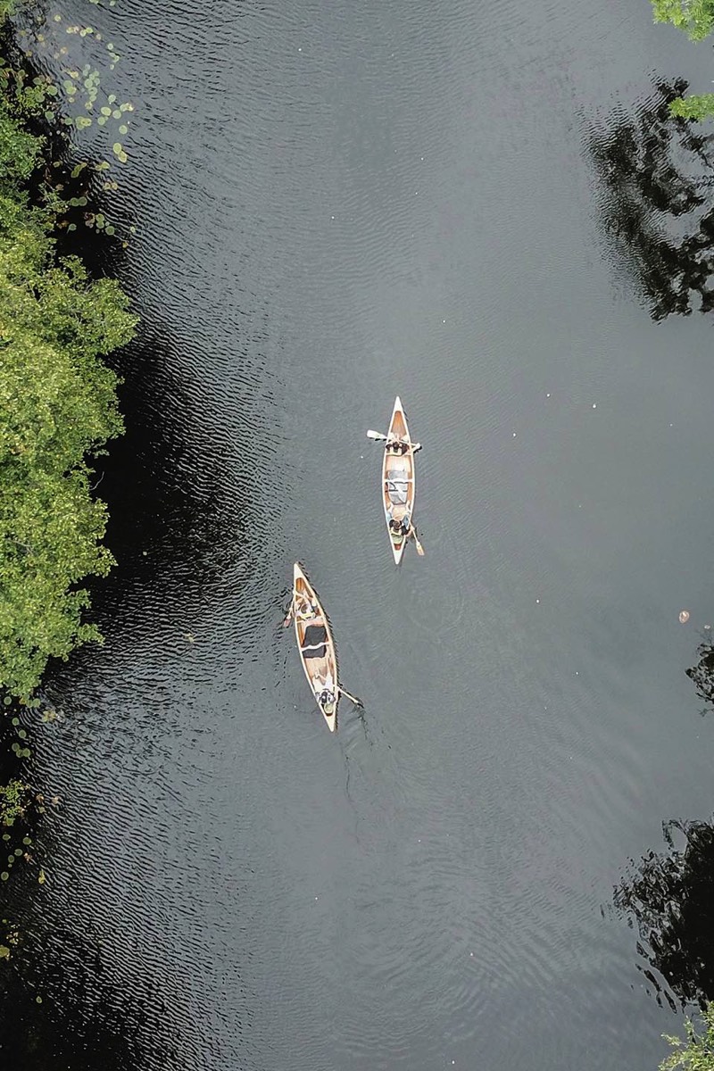 Two canoes cruising in the canal